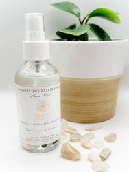 Aromatherapy aura mist spray with moonstone crystals.